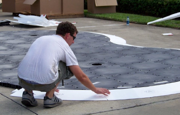 Person installng foam contours