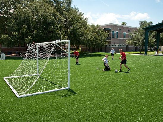 Children Playing Soccer on Turf Field