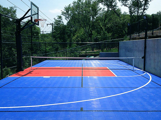 Red and Blue Multi-Sport Game Court with Basketball goal and volleyball net