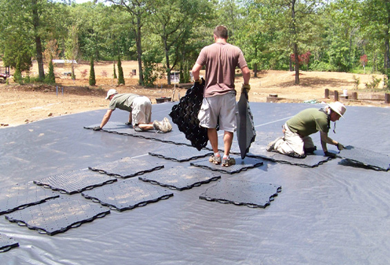 Men laying down ultra base tiles