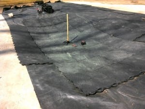 ultrabasesystems panels on top of geotextile fabric contouring to hilly landscape