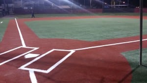 completed red artificial turf baseball diamond home base