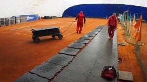team installs ultrabasesystems panels to dirt floor court
