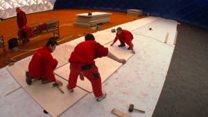 team lays wood plates over ultrabasesystems panel base
