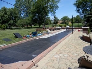 ultrabasesystems panels being laid down for backyard putting green