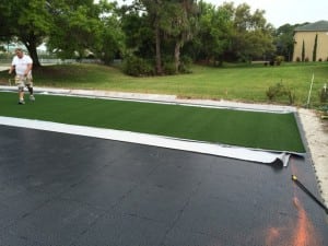 artificial turf laid out onto ultrabasesystems panels for backyard soccer field
