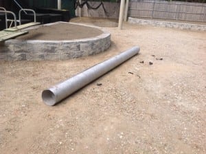 roll of geosyntheitc fabric on compacted gravel