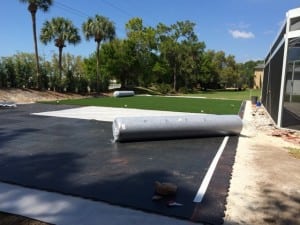 rolls of artificial turf on ultrabasesystems panels