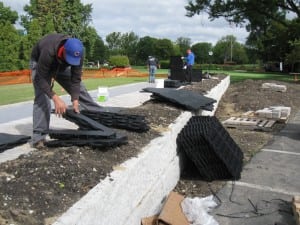 team laying ultrabasesystems panels for tee line installation