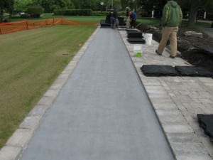 team laying ultrabasesystems panels for tee line installation