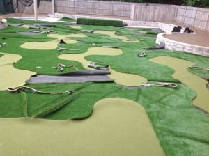 artificial turf cut out and laid out with turf scraps