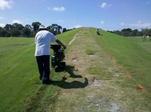 man is marking turf installation area for grass removal