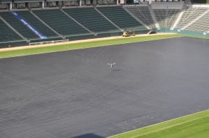 ultrabasesystems creator dave barlow stands in the middle of football field turf installation