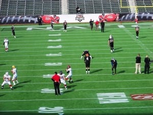 players during nflpa collegiate bowl practicing on artificial turf field
