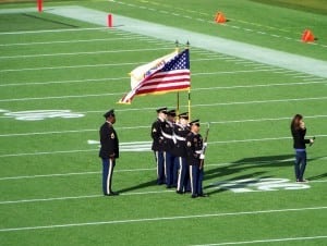 guards during national anthem on football field