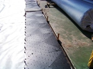 first row of ultrabasesystems panel laid on geotextile