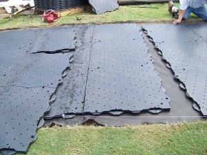attaching base panels to each other on geotextile fabric