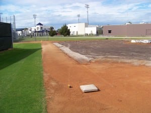 baseball field with turf dug out for installation