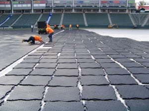 row view of connected and loose base panels for football field installation