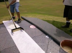 turf glue adhering two ends of turf on top of base panel system