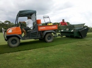 turfco topdress is pulled by a small tractor