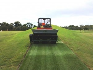 turfco tractor topdresses new artificial turf installation