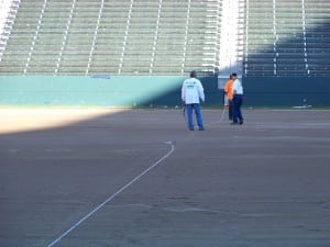 field installers discuss artificial football field turf installation