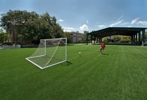 boy playing on tampa florida artificial turf soccer field installation