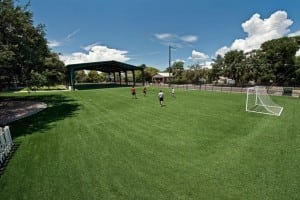 boys playing on artificial turf soccer field