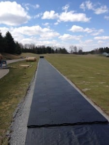 base system during artificial turf tee line installation