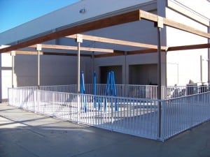 fenced concrete playground area