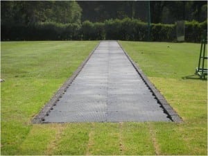 base panel system for artificial turf tee line installation
