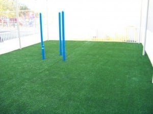 artificial grass laid before playground equipment installed