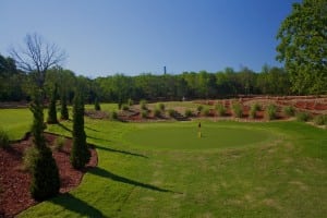 wide view of artificial putting green installation on snag golf course