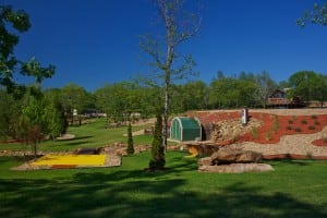 wide view of completed snag golf course with artificial turf and landscaping