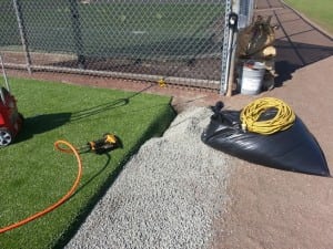 artificial turf near gravel base and installation equipment