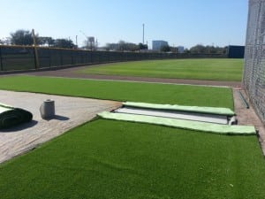 two artificial turf strips ready to be adhered together