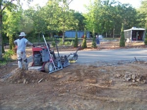 men lay out gravel base for SNAG golf green installation