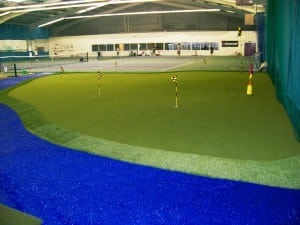 large indoor putting green installation with fringe cut grass