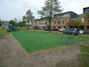 mini outdoor soccer field turf installation near playground