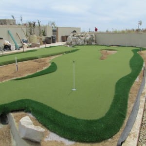 rooftop putting green installation almost complete