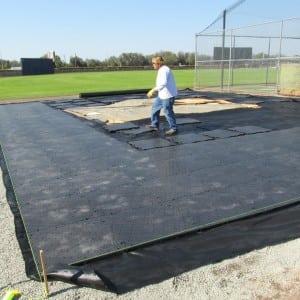 installer connects ultrabasesystems panels for Tampa baseball field turf installation
