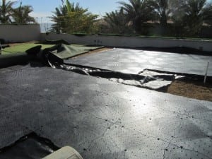 ultrabasesystems base panels on top of geotextile fabric for rooftop putting green installation