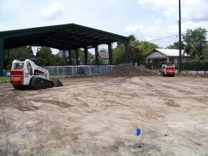 bulldozer preparing dirt field for soccer field turf installation