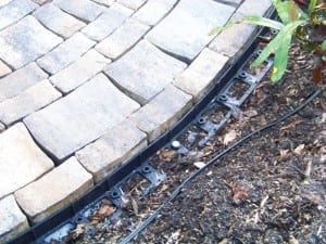 paver edge restraints on a backyard paver installation