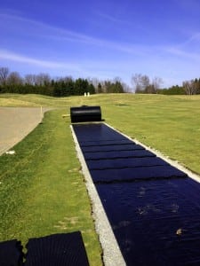 ultrabasesystems panels laid out on top of geotextile fabric for tee line turf installation