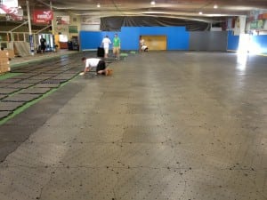 team puts together ultrabasesystems base panels for indoor artificial turf soccer field