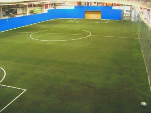 wide shot of newly installed indoor artificial turf soccer field