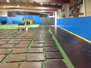 ultrabasesystems panels laid out for indoor soccer field installation