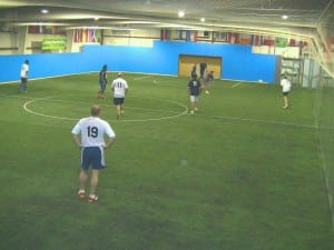 men playing soccer on new indoor artificial turf field